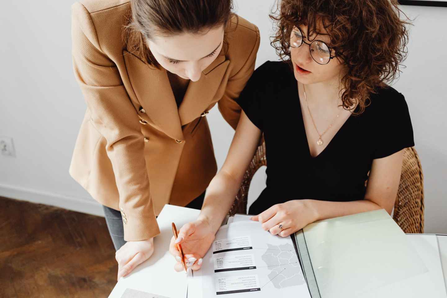 two women doing their paperwork